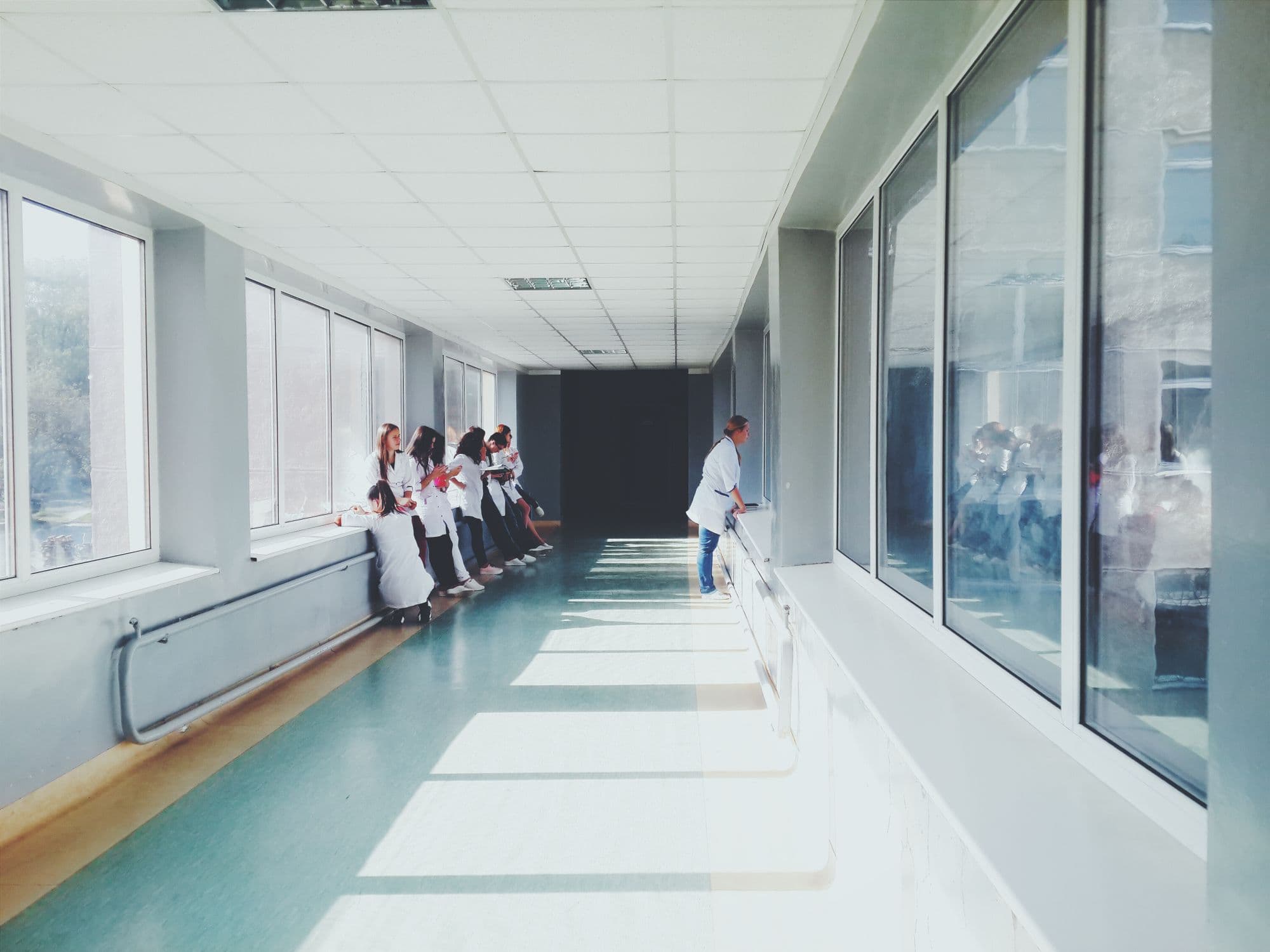 Bright healthcare facility corridor — editorial illustration